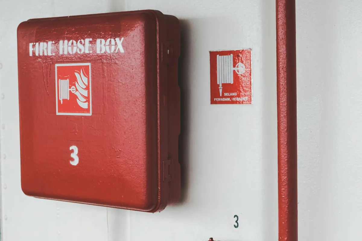 Firefighting system features – Red fire hose box for school safety by Syncology