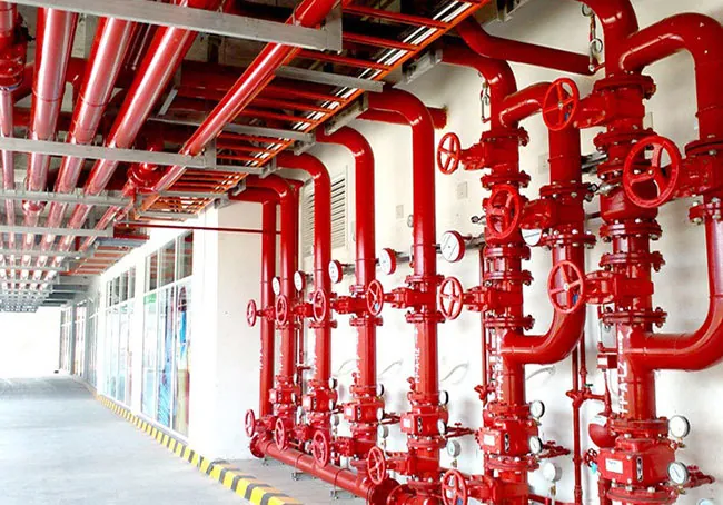 Firefighting system for schools – Red fire protection pipelines and valves installed by Syncology