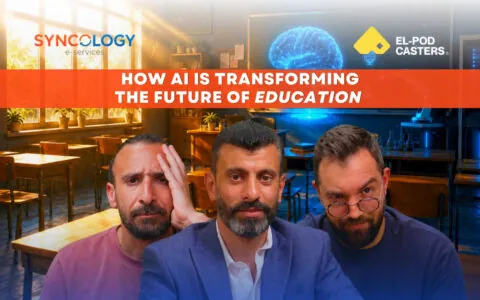 Three men showing expressive, thoughtful faces inside a classroom with a futuristic holographic brain glowing on the chalkboard, representing the Future of Education.