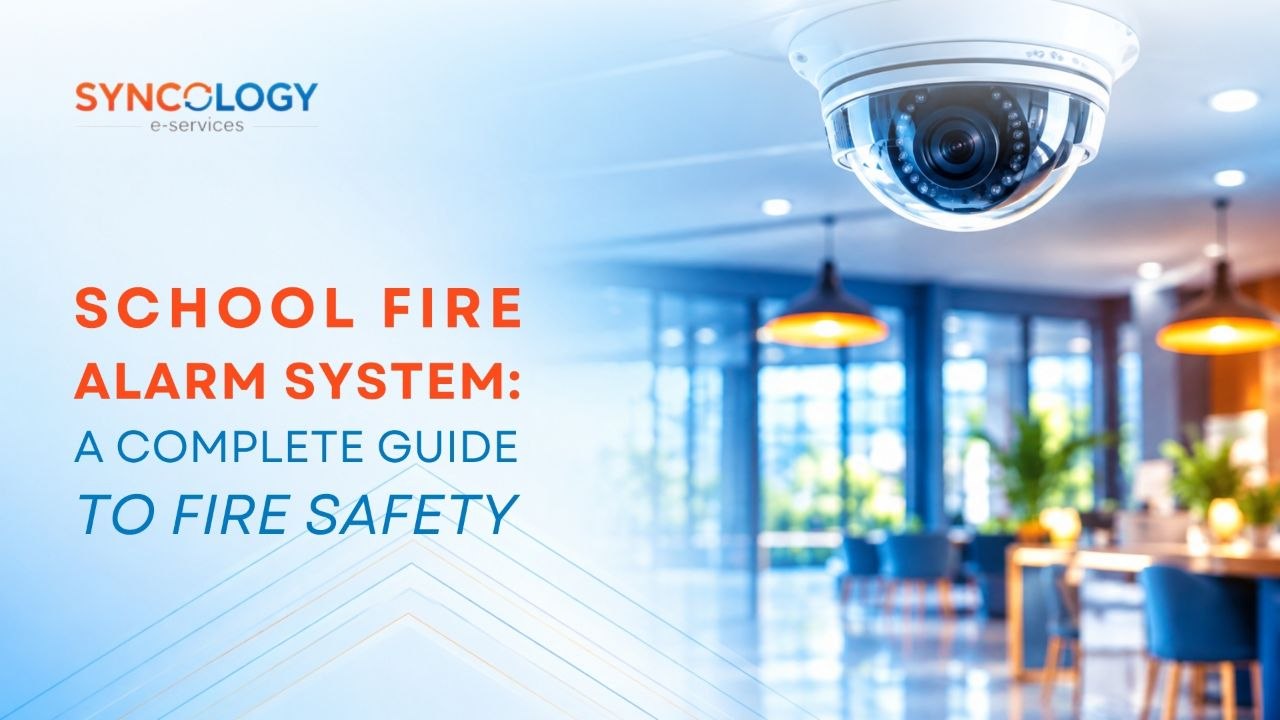 A close-up view of a ceiling-mounted security camera overlooking a modern school facility lounge, representing an integrated school fire alarm system and safety infrastructure.