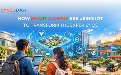 Two students with backpacks looking at a tablet projecting a 3D hologram of a smart campus with IoT, AI, Wi-Fi, and solar energy icons.